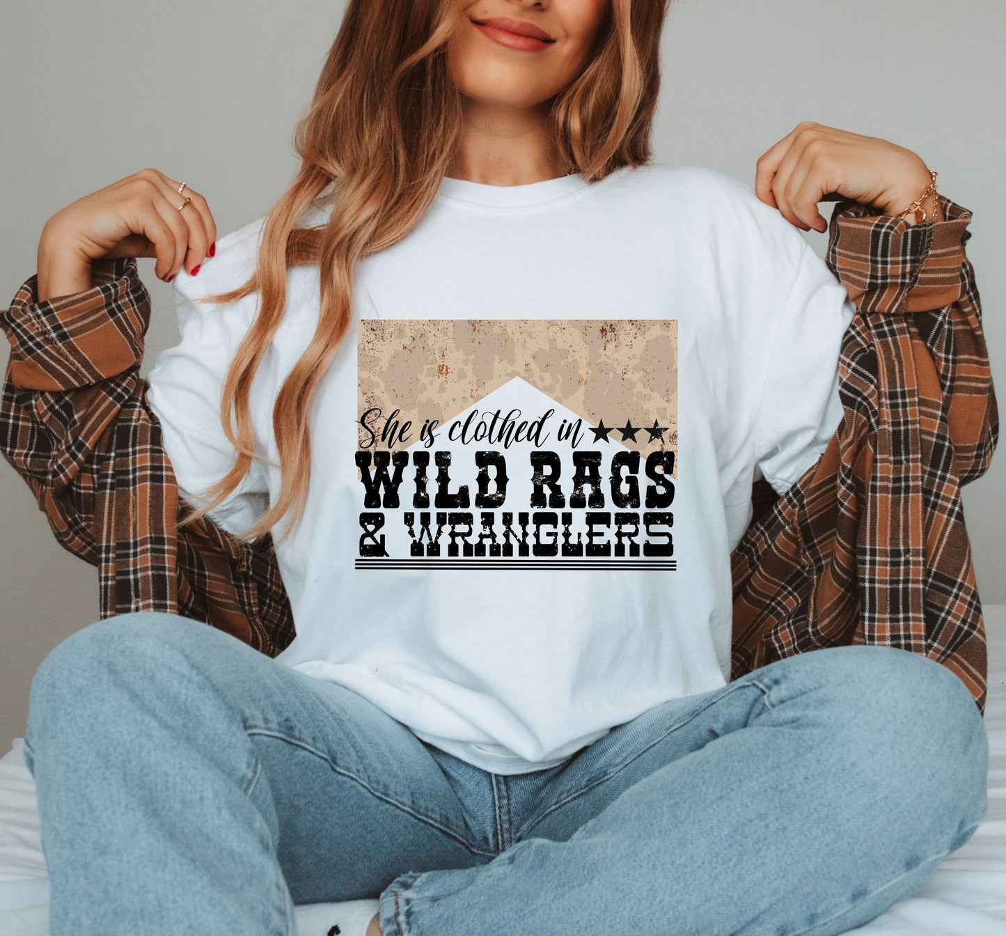 She Is Clothed In Wild Rags & Wranglers Graphic Top